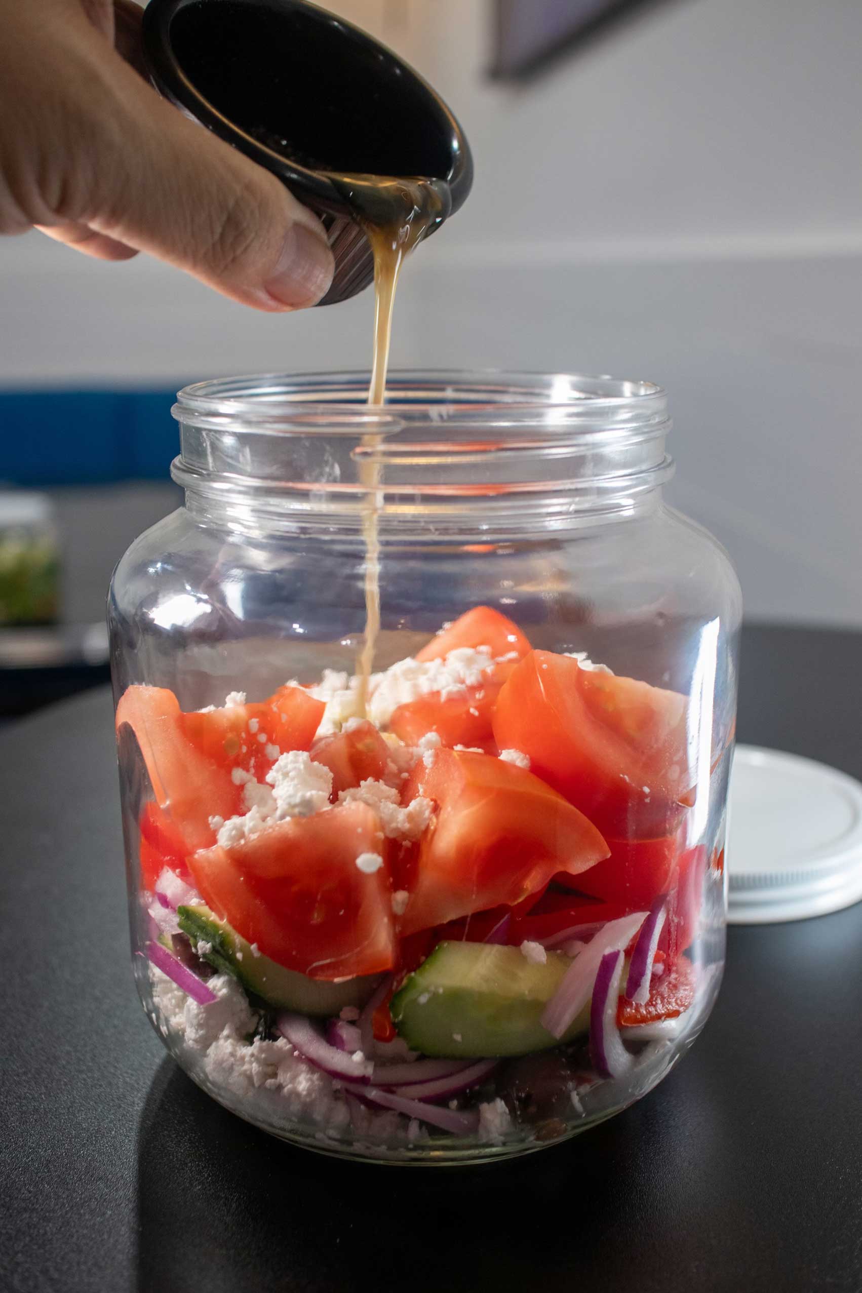 A vibrant Greek salad served in a jar from Diner 24 NYC, highlighting layers of fresh cucumbers, juicy tomatoes, sliced red onions, and creamy feta cheese, all drizzled with golden vinaigrette. Known as one of the top-rated diners in NYC, Diner 24 delivers this innovative vegetarian-friendly option that’s perfect for those seeking high-quality diner food. This refreshing dish is a go-to choice for comfort food lovers, whether you’re exploring affordable NYC comfort food or visiting one of NYC’s best American diners. Ideal for vegan-friendly breakfast spots or late-night dining in Manhattan, this salad perfectly blends creativity and flavor.
